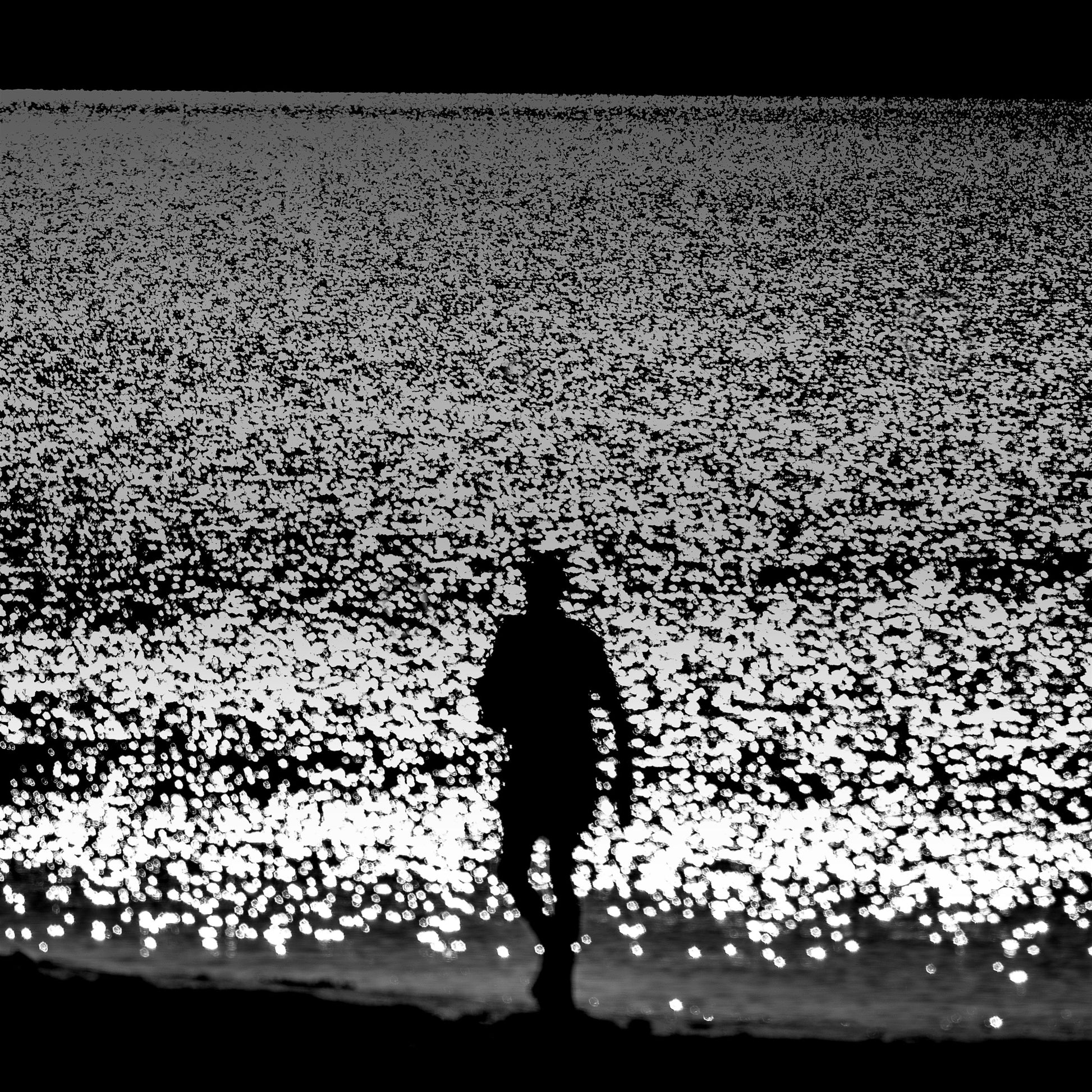 Tabi no Hito — lone figure walking on a glittering silver shoreline, black and white fine art photography